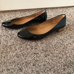 Black flats with gold heel